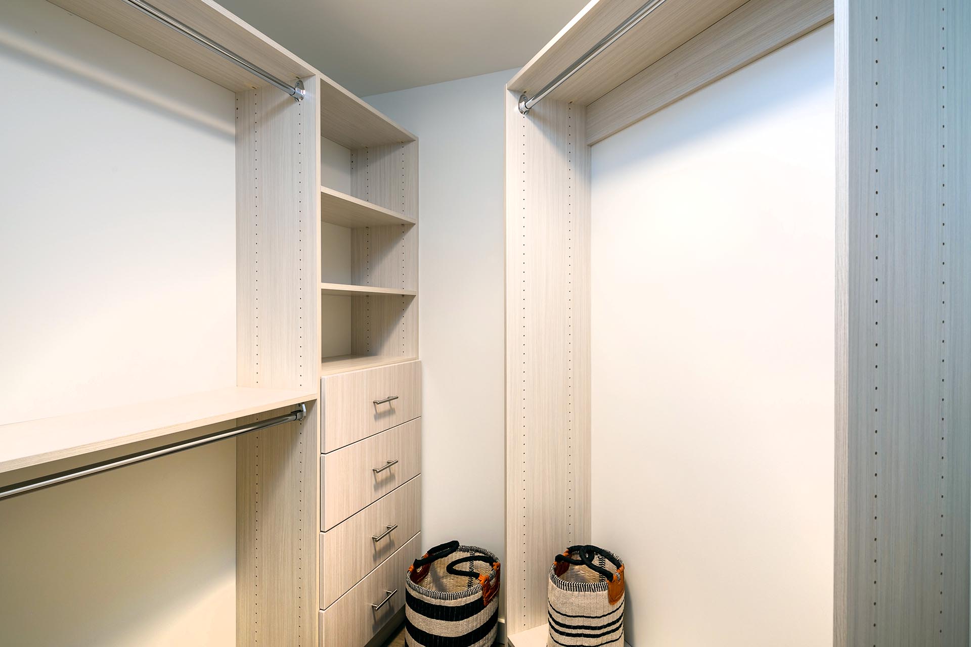 Spacious closet with lots of shelf space and hanger rods